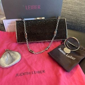 Judith Lieber clutch with accessories.
